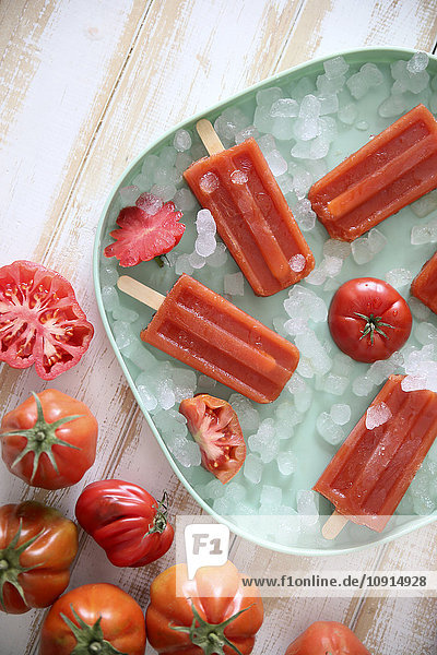 Plate of tomato ice lollies