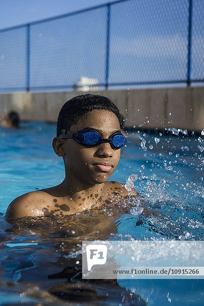 Teenage boy in swimming pool