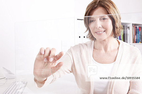 Woman using transparent touchscreen display