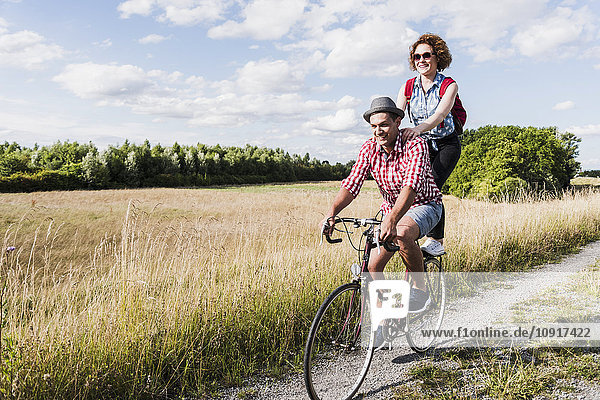 Happy young couple on a bicycle tour