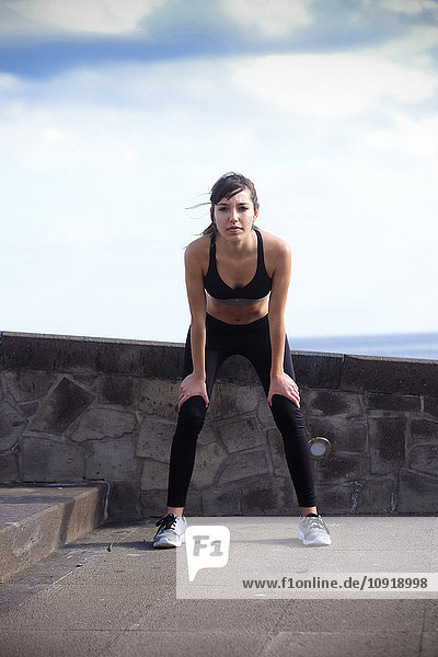 Portrait of young woman doing workout