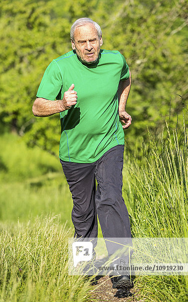Senior man jogging in nature