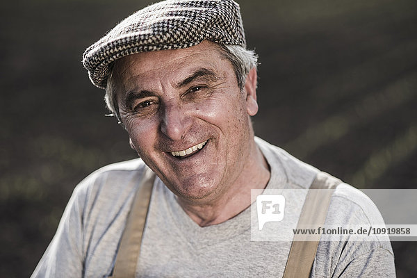 Portrait of smiling farmer at a field