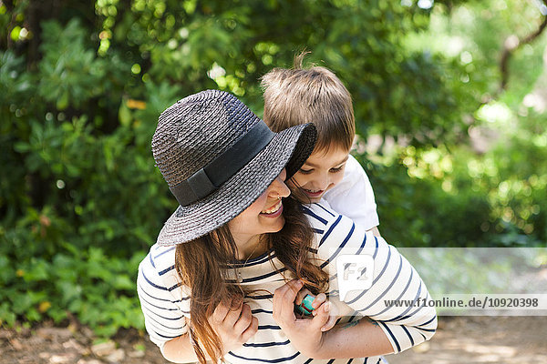 Playful mother and son outdoors
