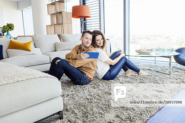 Couple relaxing in modern apartment