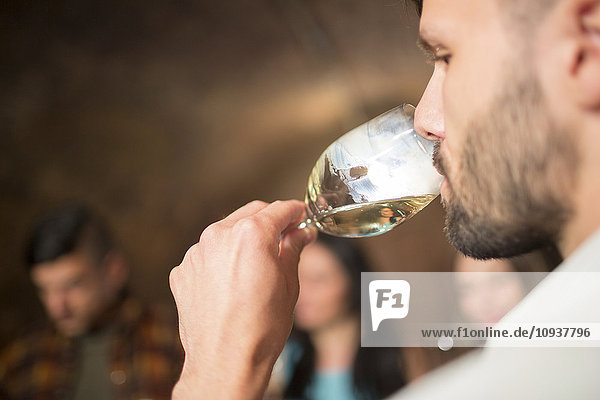 Man at campsite drinking white wine