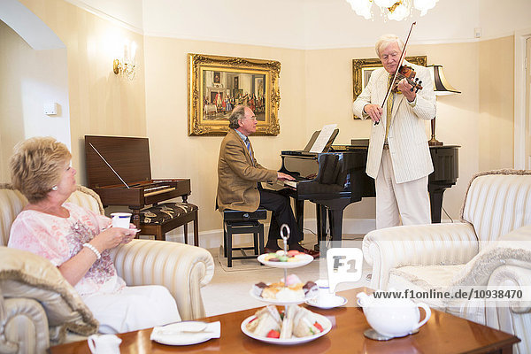 Tea party with music performance in background