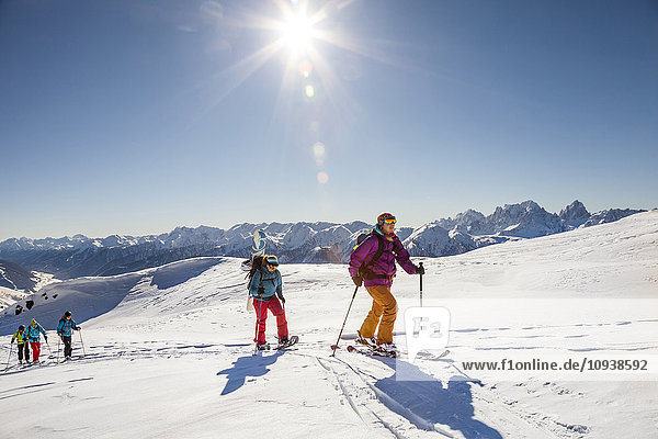 Group of ski tourers walking in Sexten Dolomites