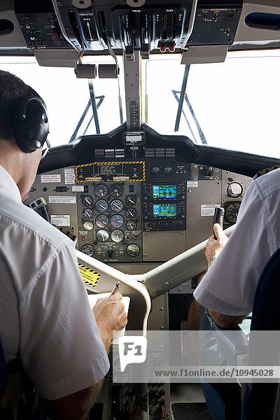 Pilots working in cockpit