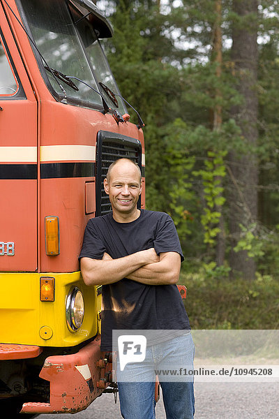 Man leaning on truck