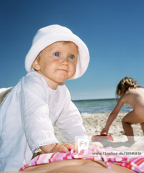 Children on sandy beach in summer