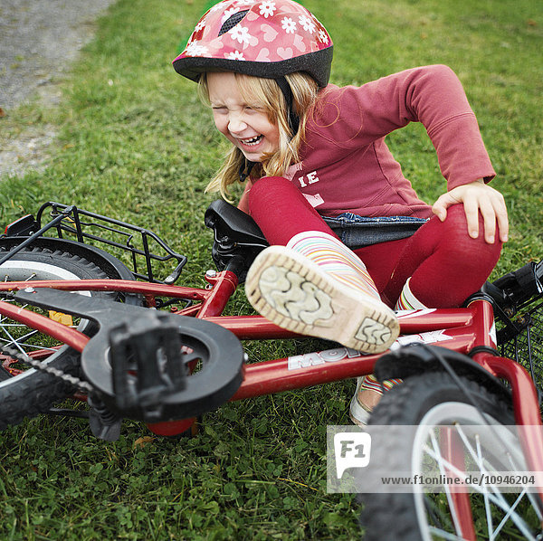 Girl falling from bicycle