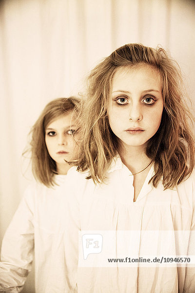Portrait of two girls in halloween make-up