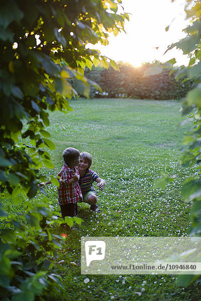 Two boys playing in a park
