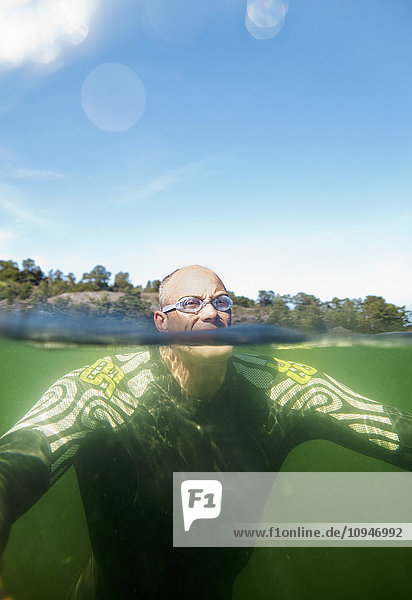 Man surfacing from underwater