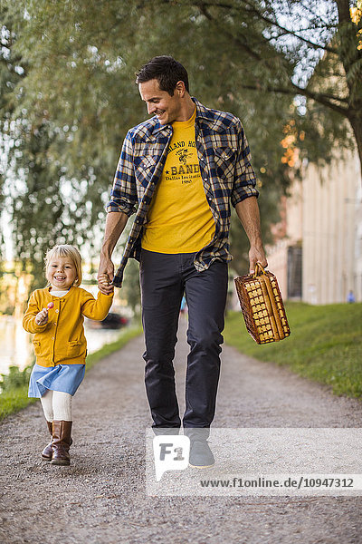 Father walking with girl