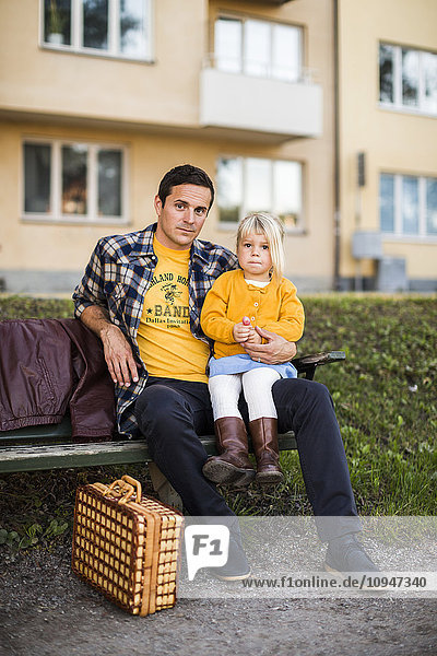 Father with daughter on bench