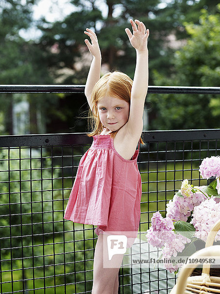 Girl standing on balcony