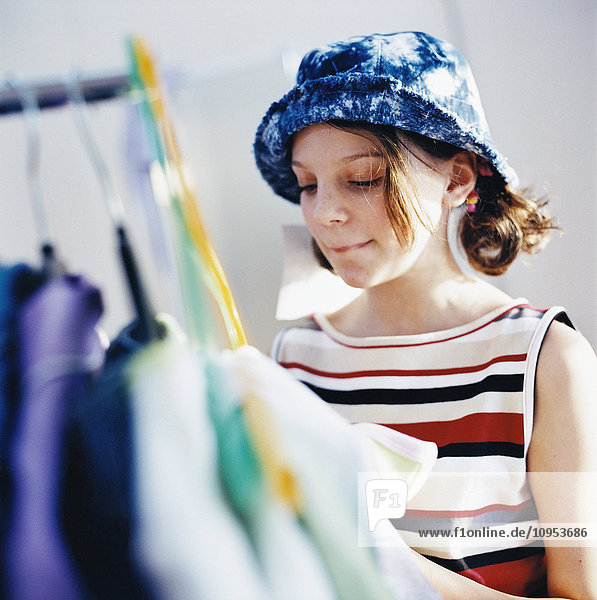 Teenage girl choosing clothes