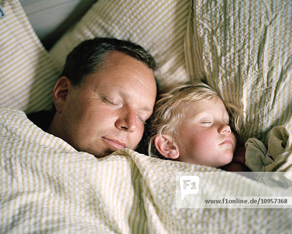 Father and child sleeping  Sweden.