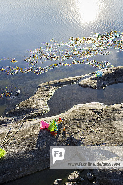 Toys on a rock by the sea  Sweden.