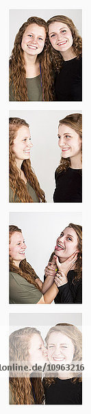 'Two young women creating photo booth series of images in filmstrip format; Alberta  Canada'