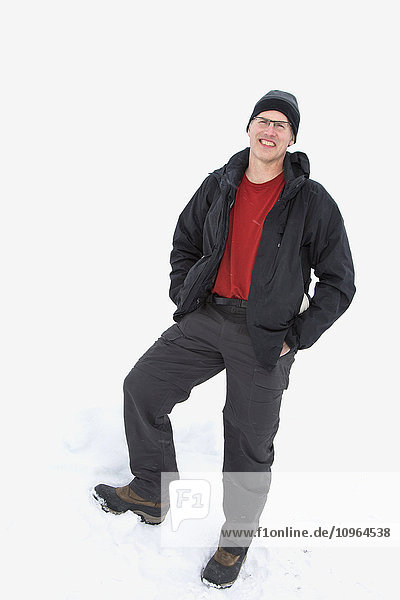 Male dressed in winter gear and standing against a snowbank  Barrow  North Slope  Arctic Alaska  USA  winter