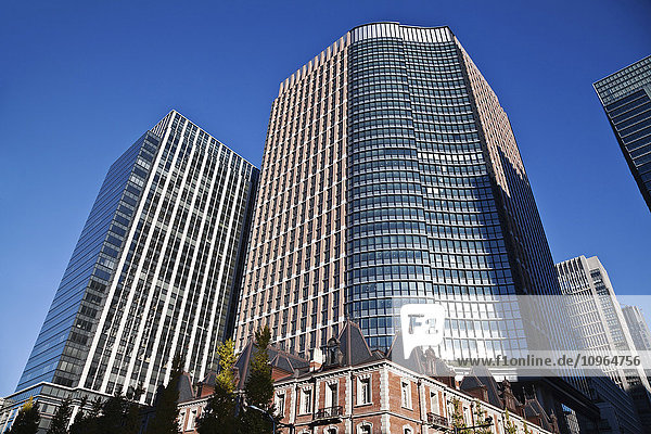 'Skyscrapers against a blue sky; Tokyo Japan'