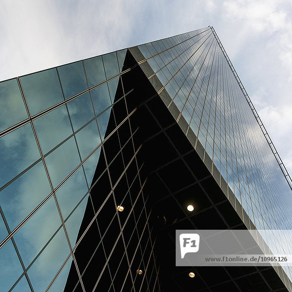 'Skyscraper with glass walls reflecting the sky; Dallas  Texas  United States of America'