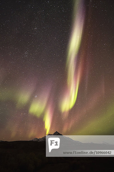 'Northern Lights (aurora borealis) over top of Angelcomb Peak Dempster Highway; Yukon Canada'