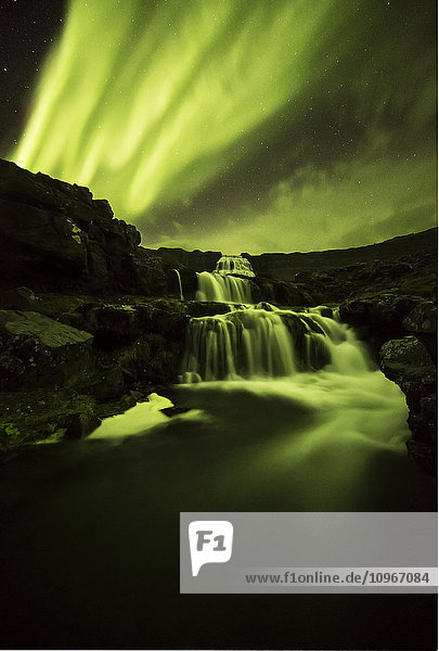 'Northern lights over Dynjandi in the Westfjord region of Iceland Dynjandi is a series of seven waterfalls; Westfjords Iceland'