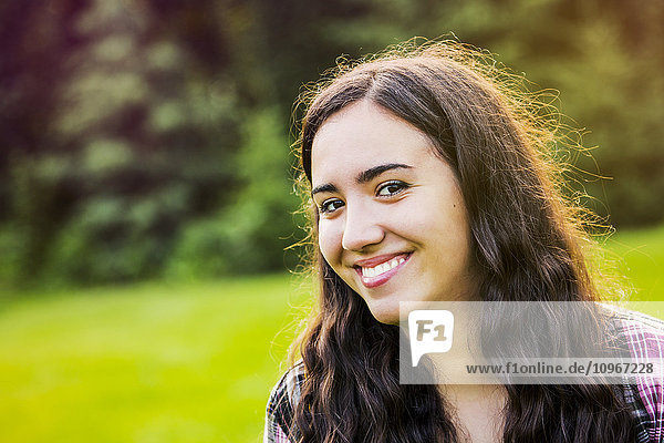 'Portrait of a young woman outdoors at sunset; Sherwood Park  Alberta  Canada'
