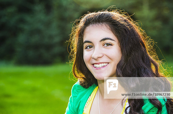 'Portrait of a young woman outdoors at sunset; Sherwood Park  Alberta  Canada'