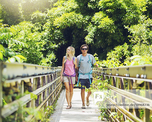 Attractive young couple having fun together outdoors on hike
