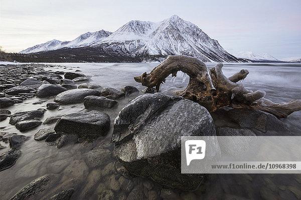 'Kathleen Lake at sunrise during winter freeze up Kluane National Park; Yukon Canada'