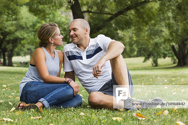 'A married couple spending quality time together in a park; Edmonton  Alberta  Canada'