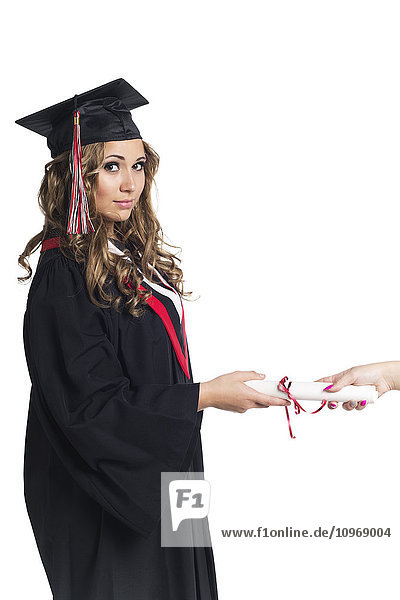 'Young woman graduate receiving her diploma; Edmonton  Alberta  Canada'