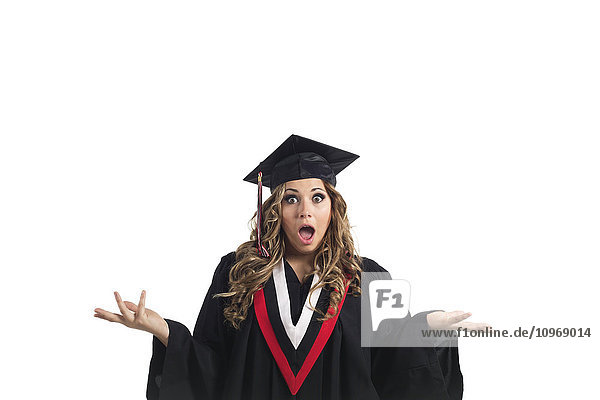 'Young graduating woman making a funny face of surprise; Edmonton  Alberta  Canada'