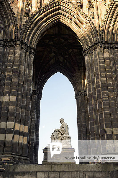 'Ornate facade of an arched niche with Scott Monument  Princes Street Gardens; Edinburgh  Scotland'