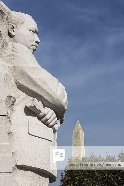 'Martin Luther King Junior Memorial  located on four acres along Tidal Basin  dedicated in 2011  30 foot granite sculpture called Stone of Hope by Lei Yixen  Washington Monument in the background; Washington  District of Columbia  United States of America'