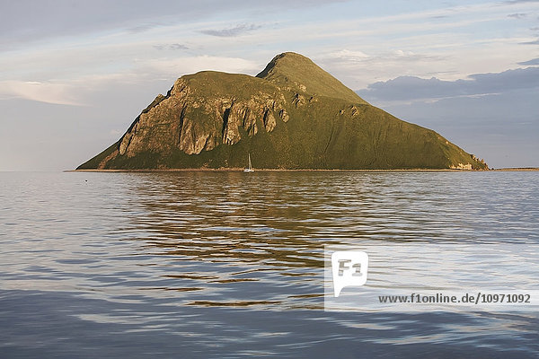 'Sailboat In Front Of Amagat Island Between Morzhovoi Bay And Cold Bay On The Alaska Peninsula; Southwest Alaska  United States Of America'
