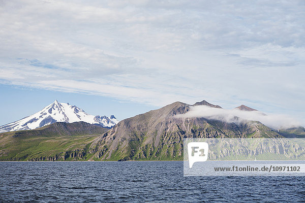 'Frosty Volcano And The Alaska Peninsula In The Summer; Southwest Alaska  United States Of America'