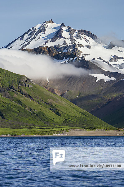 'Frosty Volcano Near Cold Bay On The Alaska Peninsula In Summertime; Southwest Alaska  United States Of America'