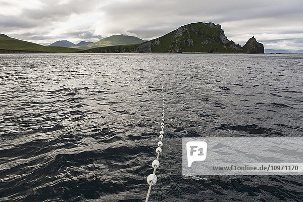 'A Gillnet Catching Salmon As It Stretches Towards Cape Pankoff On Unimak Island; Alaska  United States Of America'