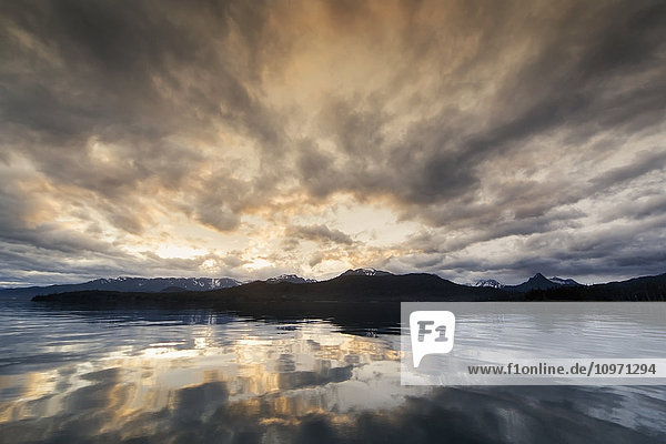 'Morning Light And Clouds Reflect On The Glassy Waters Of Kachemak Bay  Kenai Peninsula; Alaska  United States Of America'