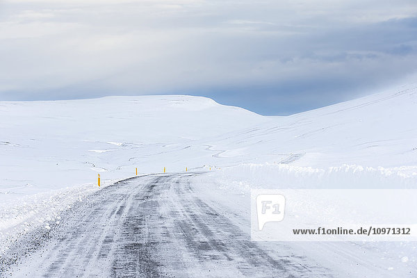 'Highway Weaving Through The Snowy Landscape; Northern Iceland'