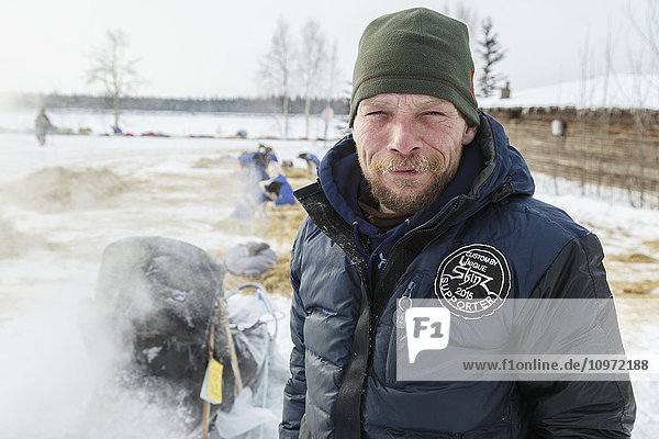 Jason Mackey portrait on the banks of the Yukon river at the Tanana checkpoint during Iditarod 2015