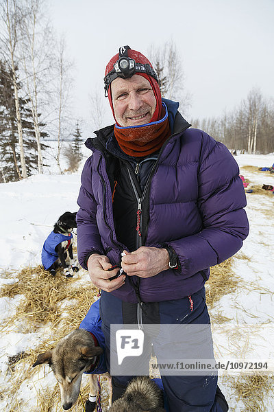 Dr. Mark Selland with his dog team along the Yukon River at the Tanana checkpoint during Iditarod 2015