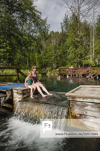Mother and daughter in Liard Hot Springs  British Columbia  Canada  summer