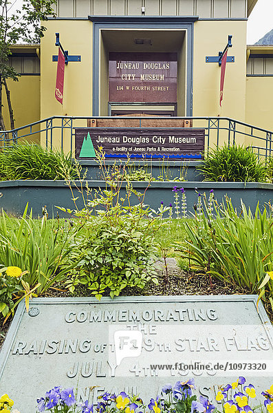 Front entrance of Juneau Douglas City Museum in Juneau with plaque commemorating the raising of the Alaska flag on July 4th  1959  Southeast Alaska  summer